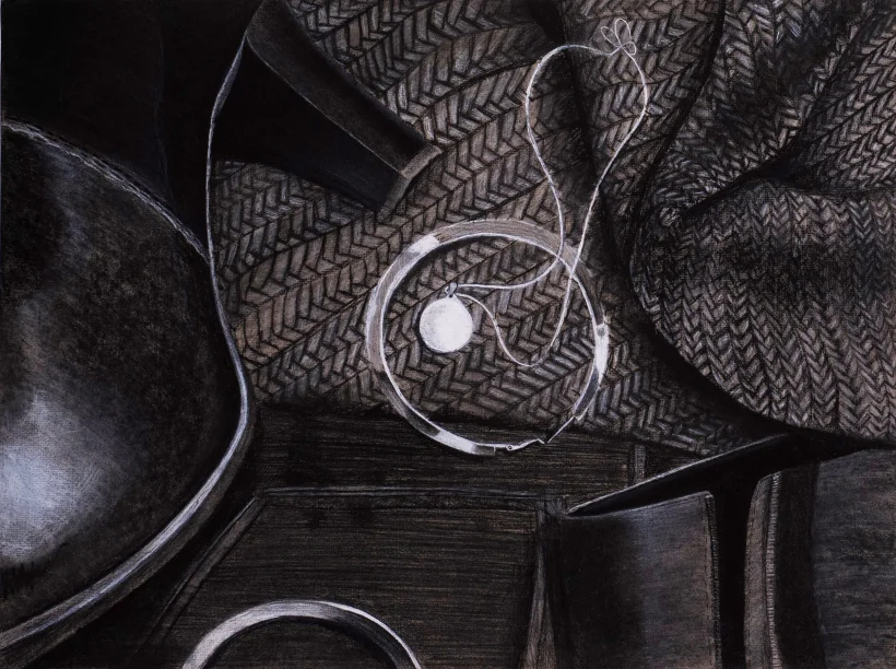 Charcoal still life: a curved metal form and a coiled wire resting on heavily patterned cloth.
